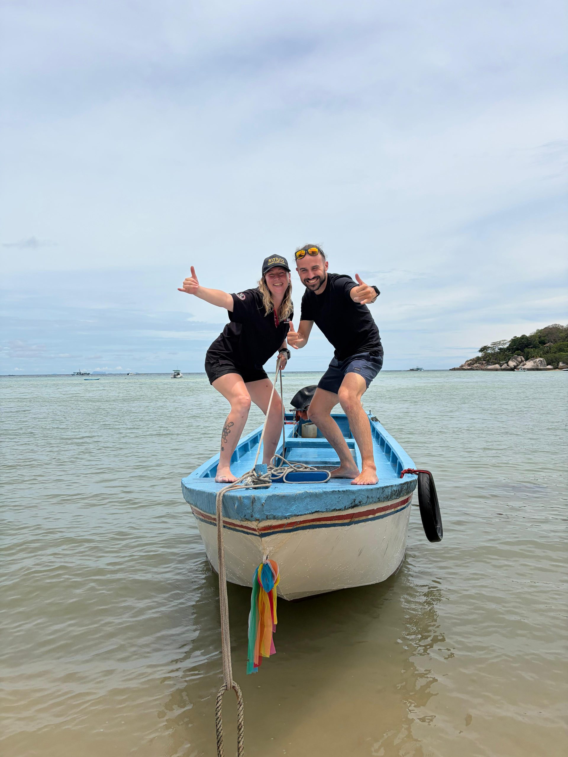 Three divers grinning on the boat after a dive with Carabao, Koh Tao