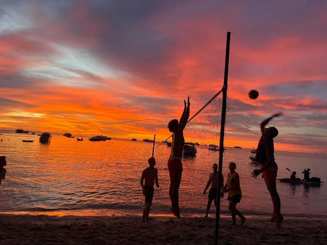 Sunset beach bar and volleyball at Carabao Diving Resort